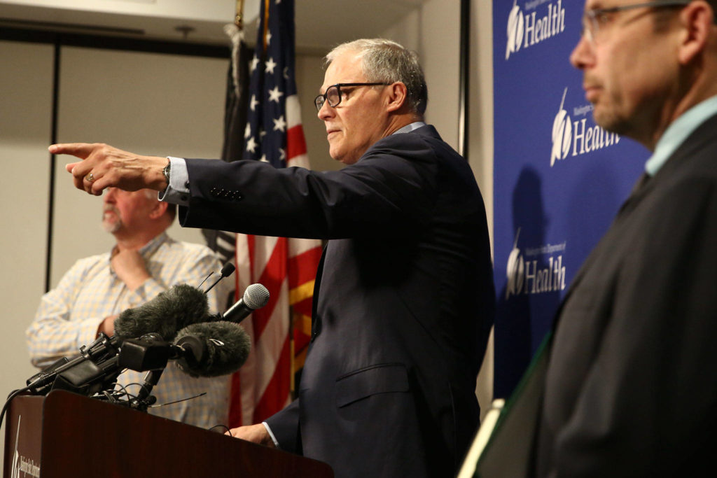 Gov. Jay Inslee fields questions during a news conference Tuesday afternoon at the state Public Health Laboratories in Shoreline. (Kevin Clark / The Herald)
