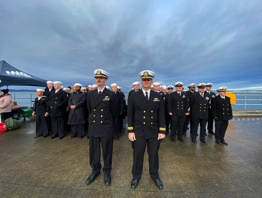Awaiting the arrival of the USS Gridley at Naval Station Everett on Tuesday morning. (Sue Misao / The Herald)
