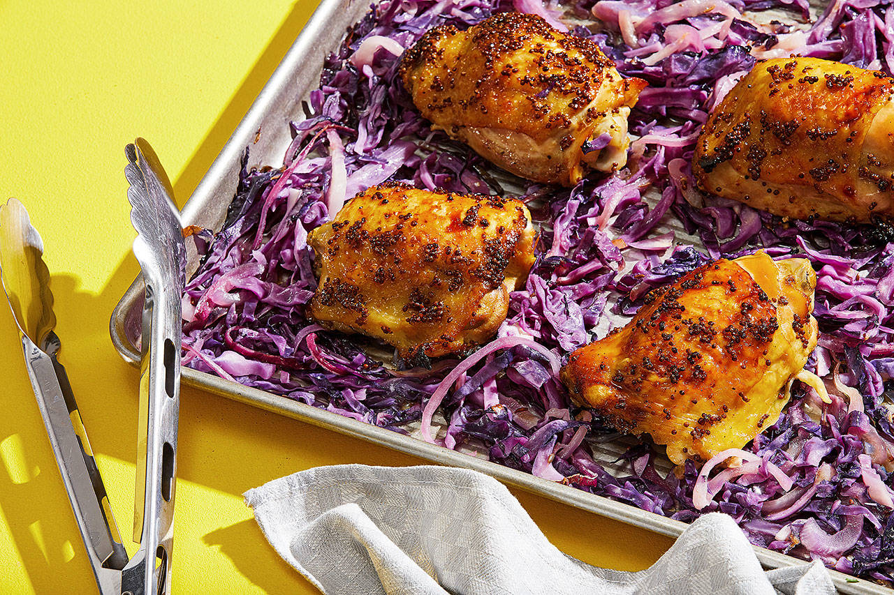 Sheet pan maple-mustard chicken thighs and red cabbage boasts extra-crispy skin without excessive grease. (Tom McCorkle / for The Washington Post)