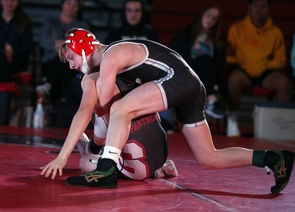 Stanwood’s Tyler Rhue gets control over Bryce Skowron as Snohomish lost to Stanwood 41-39 in a boys’ wrestling meet on Tuesday, Jan. 28, 2020 in Snohomish, Wash. (Andy Bronson / The Herald)
