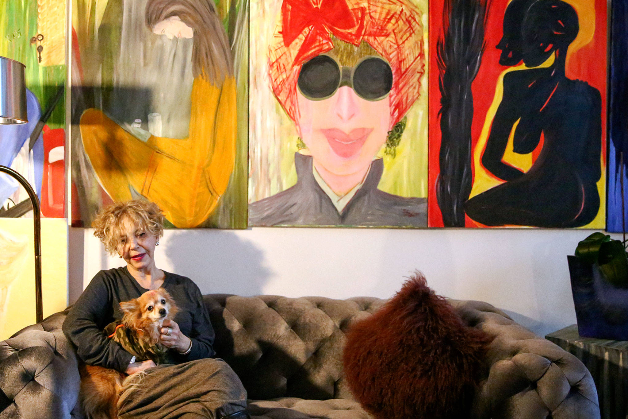 Solveig “GiGi” Sundhagen has oil paintings, jewelry and purses on display in her loft at Artspace Everett Lofts. (Kevin Clark / The Herald)