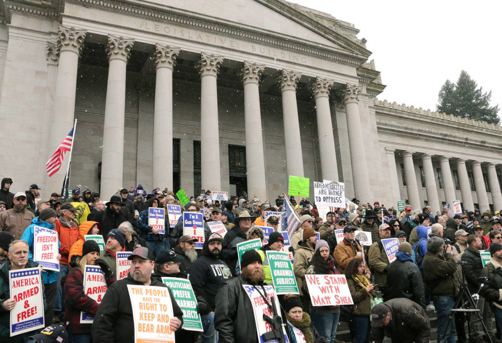 Gun-rights supporters rally on the steps of the Capitol in Olympia last Friday. (AP Photo/Rachel La Corte)
