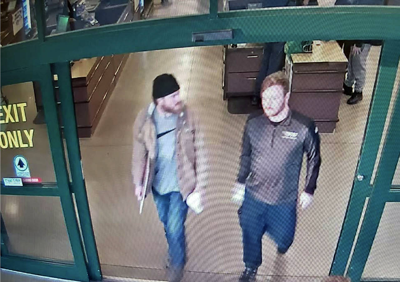This image from a Jan. 1 surveillance video shows Brian Mark Lemley Jr. (right) and Patrik Mathews leaving a store in Delaware where they purchased ammunition and paper shooting targets. The pair plotted to carry out “essentially a paramilitary strike” at a Virginia gun rights rally, a federal prosecutor said. FBI agents arrested the men on Jan. 16, as part of a broader investigation of The Base, a white supremacist group. (U.S. Attorney via AP)