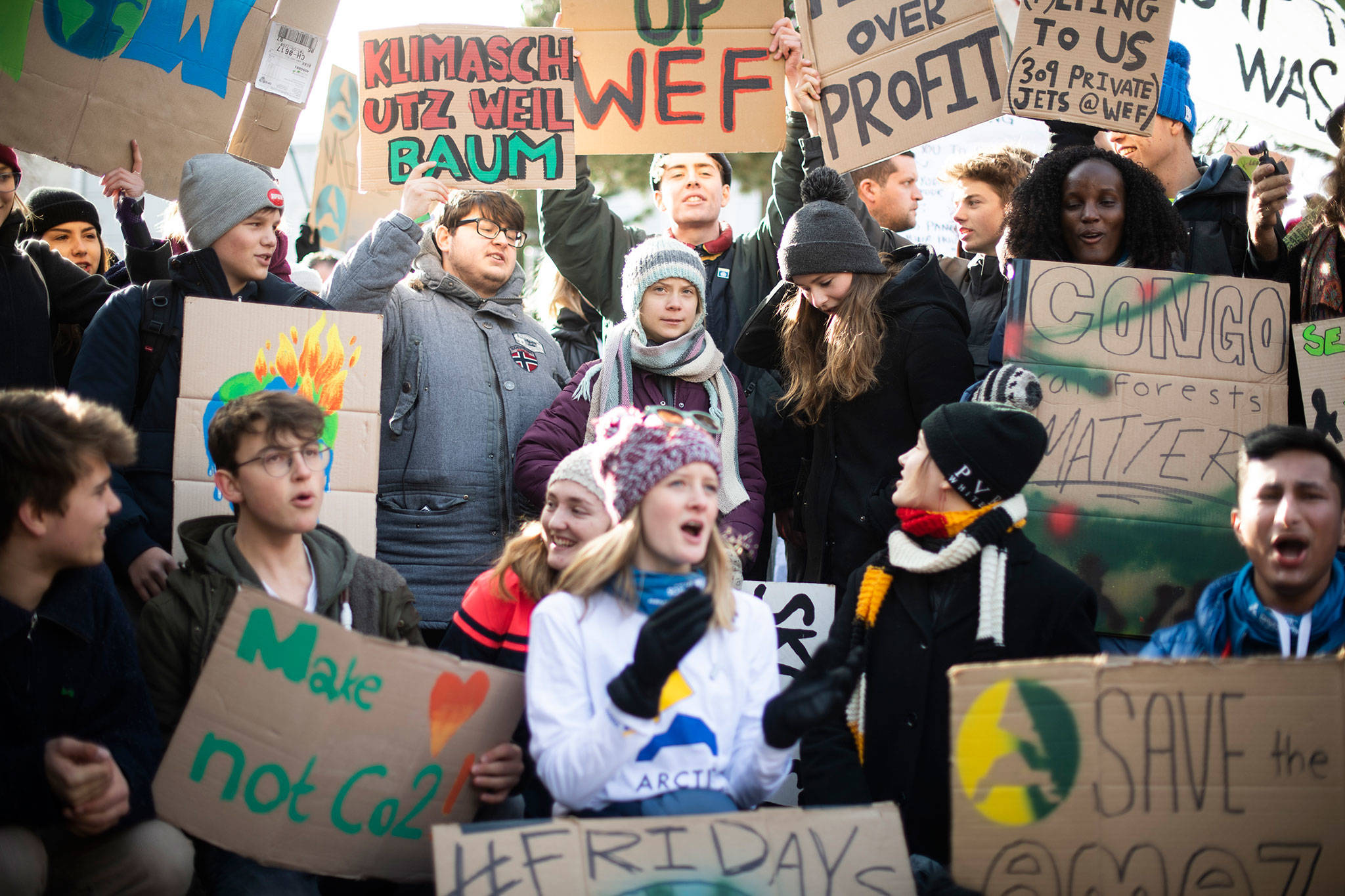 Swedish climate activist Greta Thunberg (center) joins a “Fridays for Future” demonstration on the final day of the 50th annual meeting of the World Economic Forum, WEF, in Davos, Switzerland on Friday. (Gian Ehrenzeller/Keystone via AP)