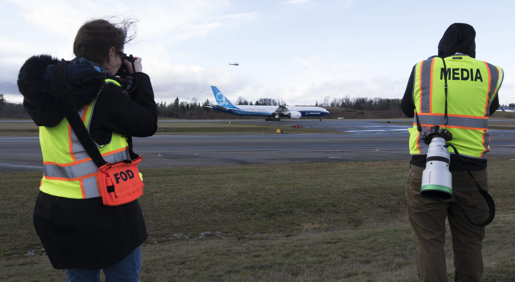 Passing members of the media, Boeing’s 777x heads back in after heavy winds forced a second cancellation of its first flight at Paine Field on Friday, Jan. 24, 2020 in Everett, Wash. (Andy Bronson / The Herald)
