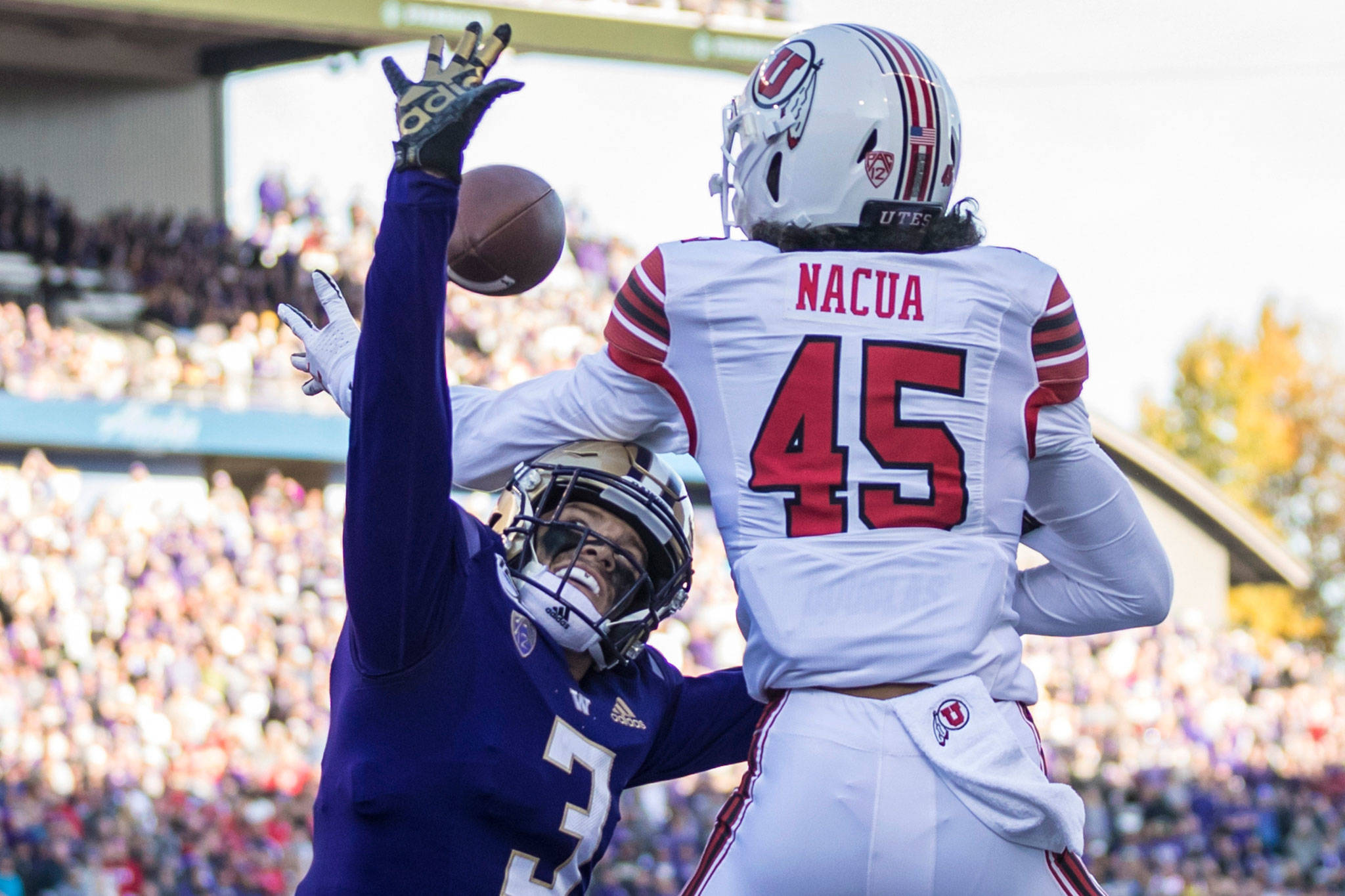 Washington defensive back Elijah Molden breaks up a pass intended for Utah wide receiver Samson Nacua during a game on Nov. 2, 2019, in Seattle. (AP Photo/Stephen Brashear)