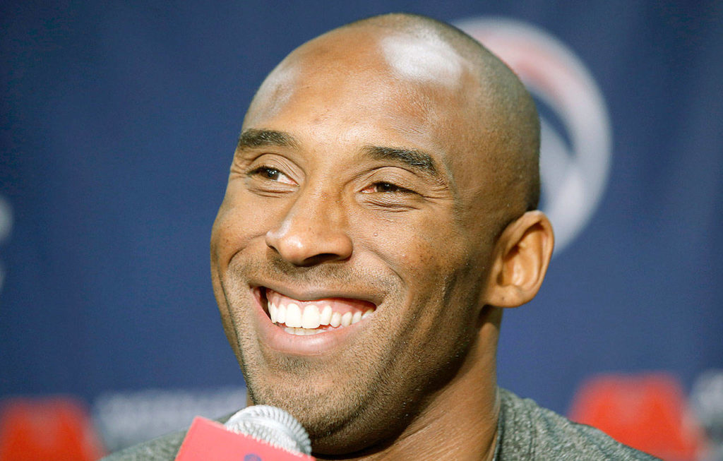 Los Angeles Lakers guard Kobe Bryant smiles Nov. 26, 2013 before an NBA basketball game against the Washington Wizards in Washington. The retired NBA superstar died Sunday in a helicopter crash, along with four others including his 13-year-old daughter Gianna, in Southern California. (AP Photo/Alex Brandon)
