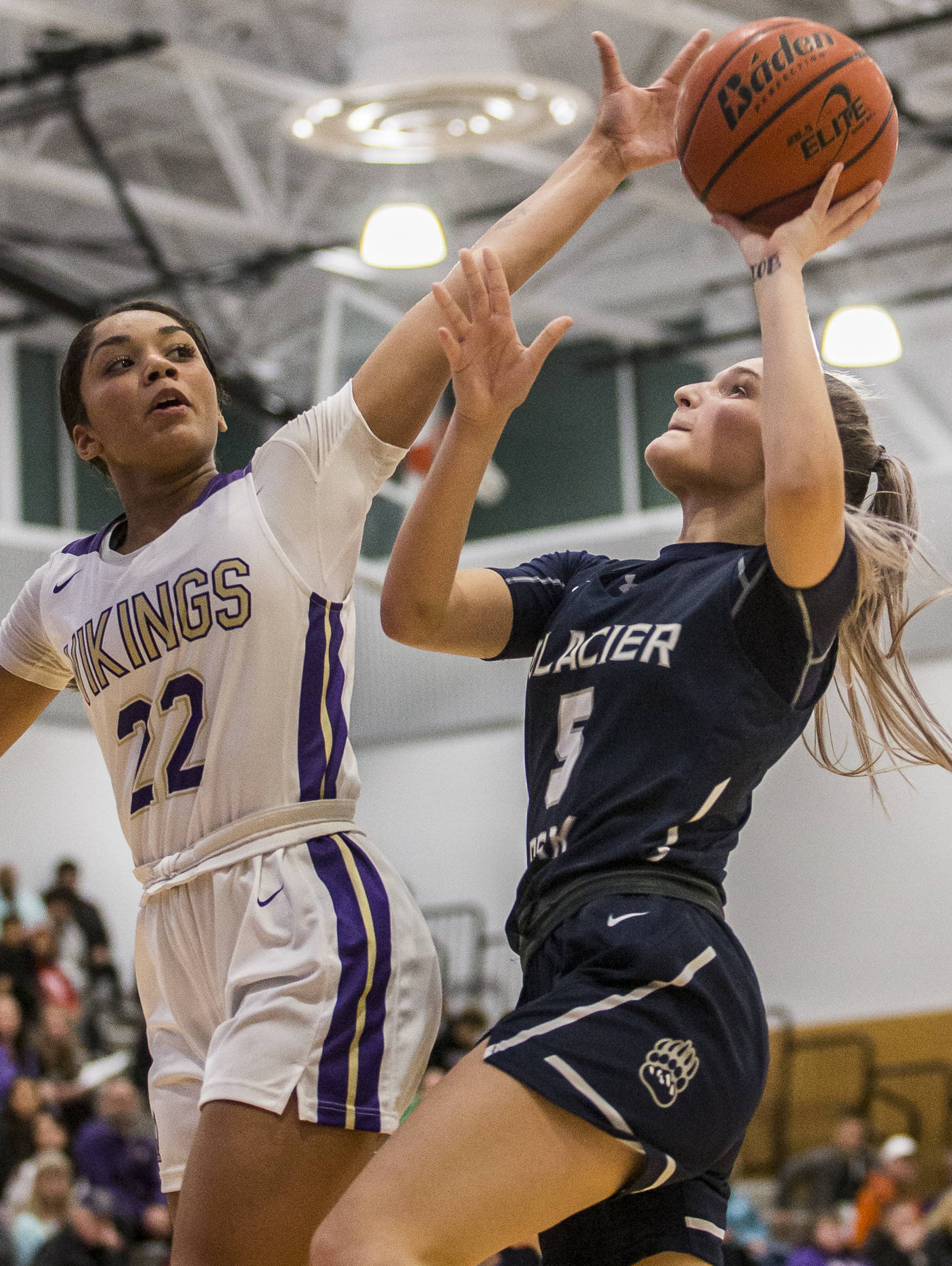 Lake Stevens’ Raigan Reed jumps to block a layup by Glacier Peak’s Shaylin Sande during a game at Lake Stevens High School on Saturday, Jan. 4, 2020, in Lake Stevens. (Olivia Vanni / The Herald).