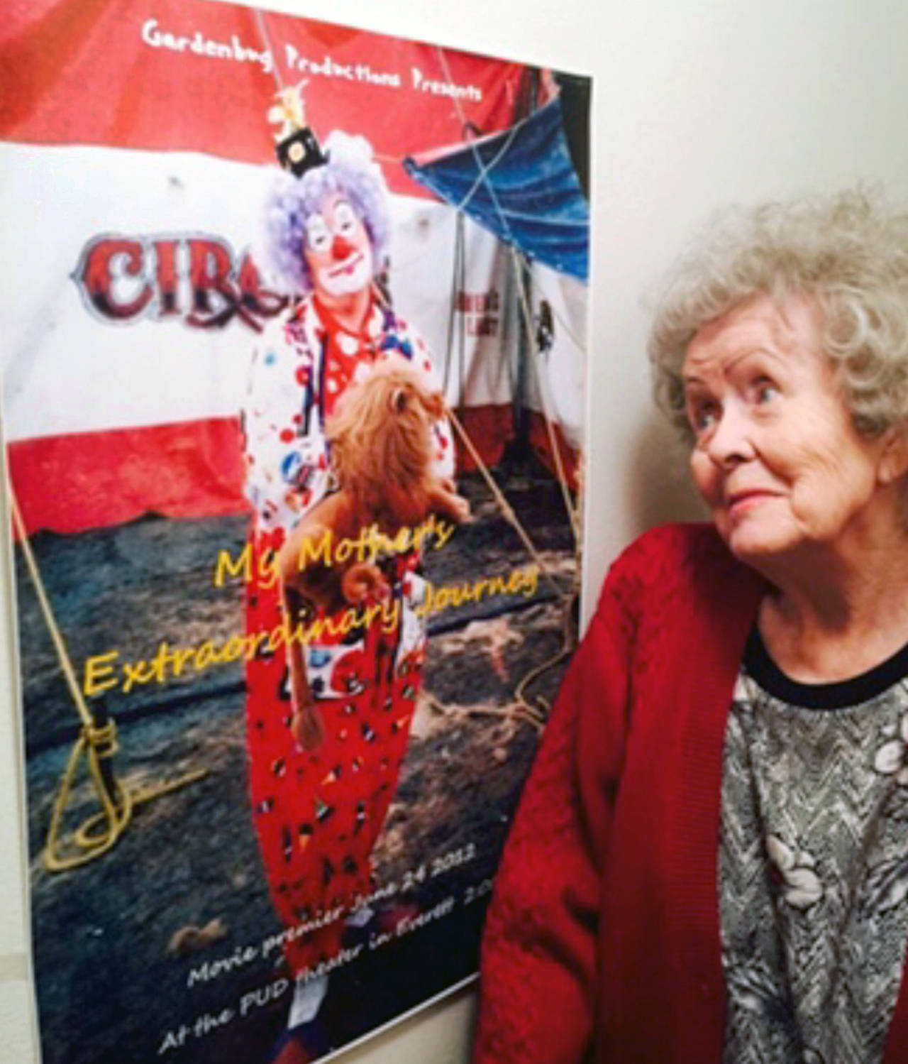 Carolyn Jean Hunt looks at a poster that features one of her alter egos — Buttons the Clown. (Family photo)