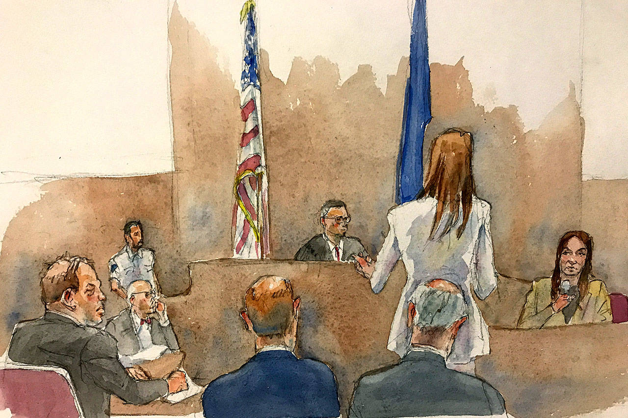 In this courtroom sketch, defendant Harvey Weinstein (far left) listens as Assistant District Attorney Megan Hast, standing before the bench second from right, gestures while witness Mimi Haleyi (far right) holds a microphone during Haleyi’s testimony in Weinstein’s sexual misconduct and rape trial on Monday. (Aggie Kenny via AP)