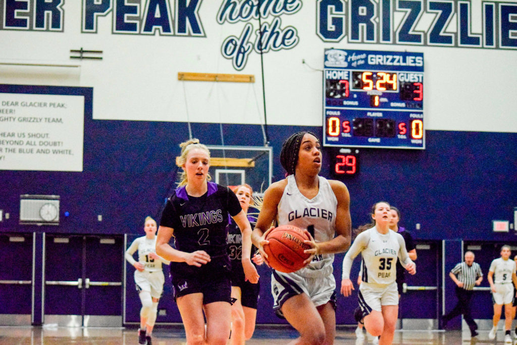 Glacier Peak’s Aaliyah Collins (right) attempts a layup against Lake Stevens on Tuesday at Glacier Peak High School in Snohomish. (Katie Webber / The Herald)
