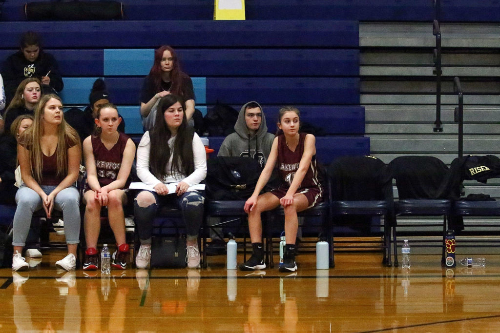 Players on the Lakewood bench watch the action on the floor during a junior varsity game Thursday evening at Sultan High School. (Kevin Clark / The Herald)
