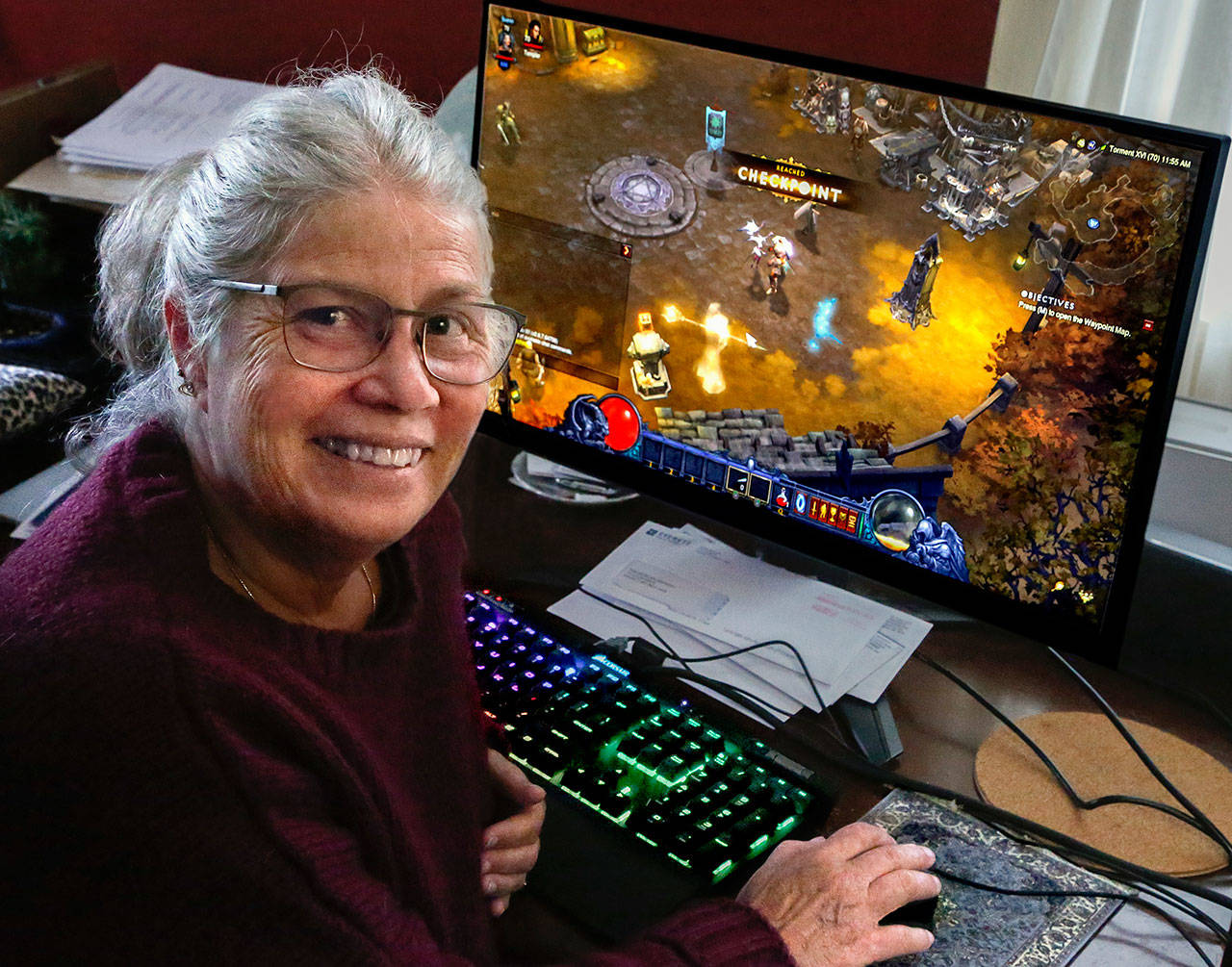 Everett resident Susan Mausshardt discovered the world of online gaming about eight years ago. She’s still an avid player — with limits. (Dan Bates / The Herald)