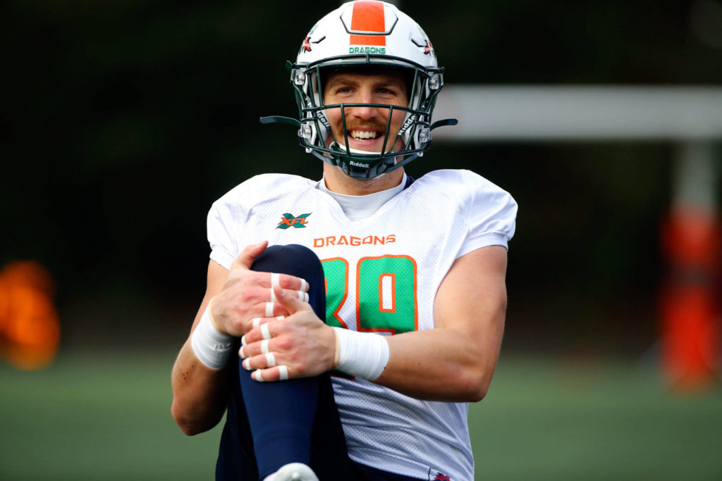 The Seattle Dragons’ Connor Hamlett, a graduate of Meadowdale High School, stretches before practice Thursday morning at Memorial Stadium in Seattle. (Kevin Clark / The Herald)
