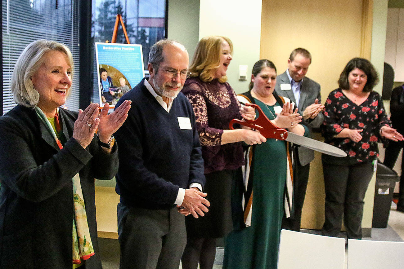 Dan Bates / The Herald                                 At Tuesday’s grand opening of the ChildStrive offices in Everett are (from left) Everett City Council President Judy Tuohy, ChildStrive CEO Jim Welsh, administrative operations director Leann Denini, Rebecca Mauldin, development and communications director, and other staff and visitors.