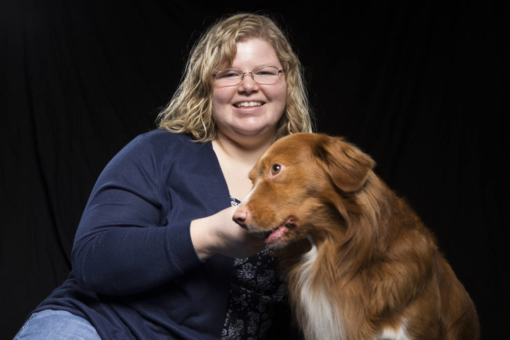Danielle Winship, 28, a Marysville native, now lives on Camano Island, with her dog, Sherman. (Andy Bronson / The Herald)
