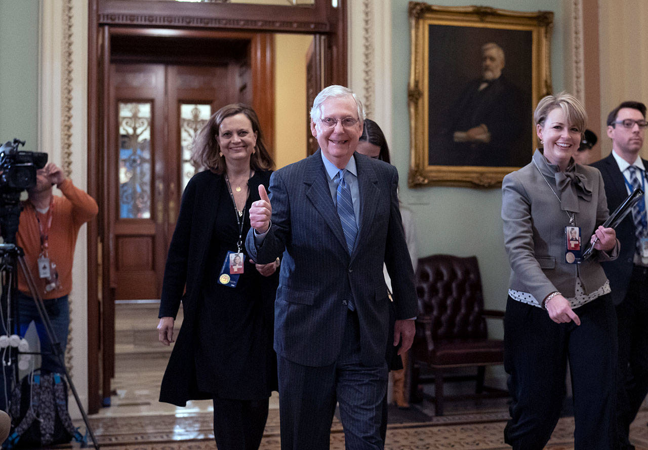 Senate Majority Leader Mitch McConnell signals thumbs-up as he leaves the Senate chamber after the impeachment trial of President Donald Trump. (AP Photo/J. Scott Applewhite)