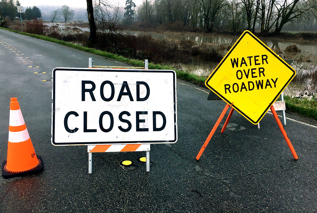 Officials warn that motorists should heed road-closure signs when pavement is flooded. (Fire District 7)