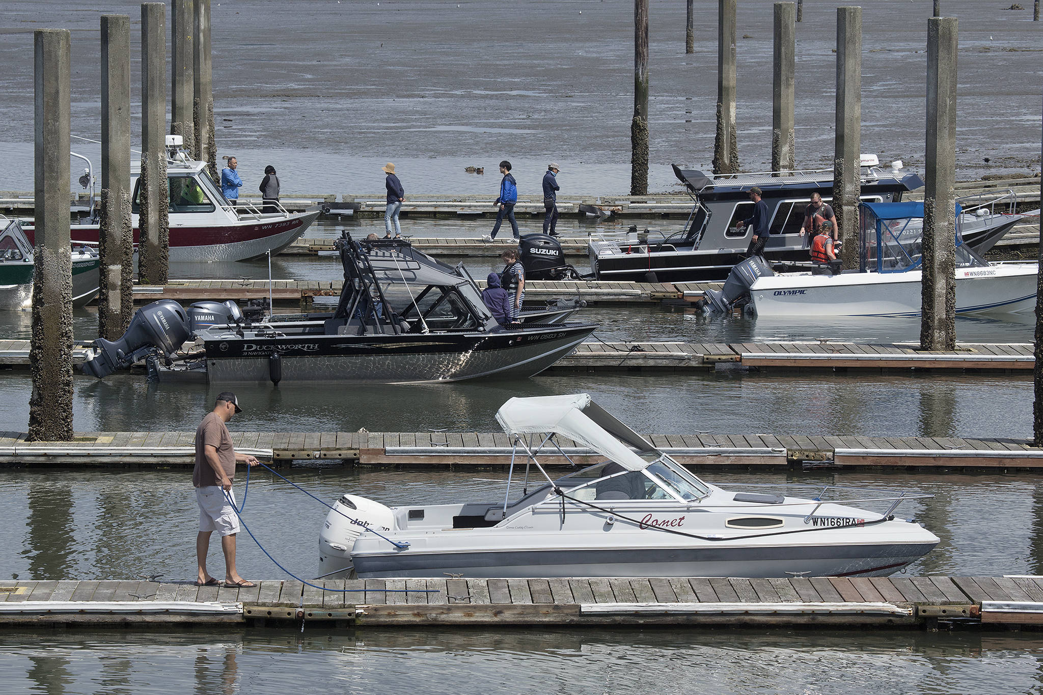 Boaters launch and retrieve their vessels July 19 during the fishing and shellfish season at the Jetty Landing and Boat Launch in Everett. (Andy Bronson / Herald file)