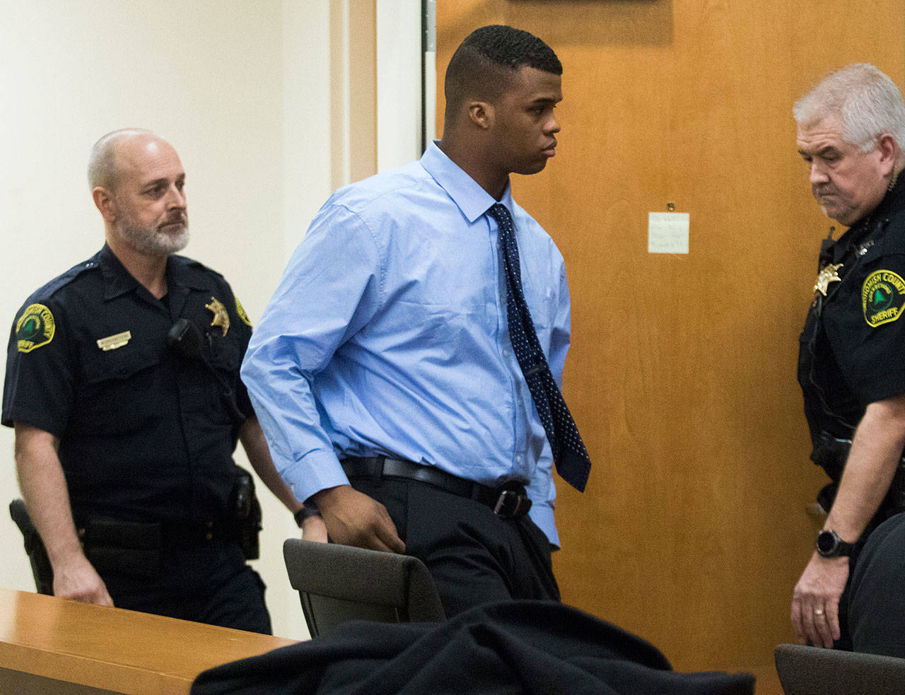 Edmond Overton enters the Snohomish County Courthouse on the opening day of his trial for first degree murder on Jan. 29 in Everett. (Andy Bronson / Herald file)