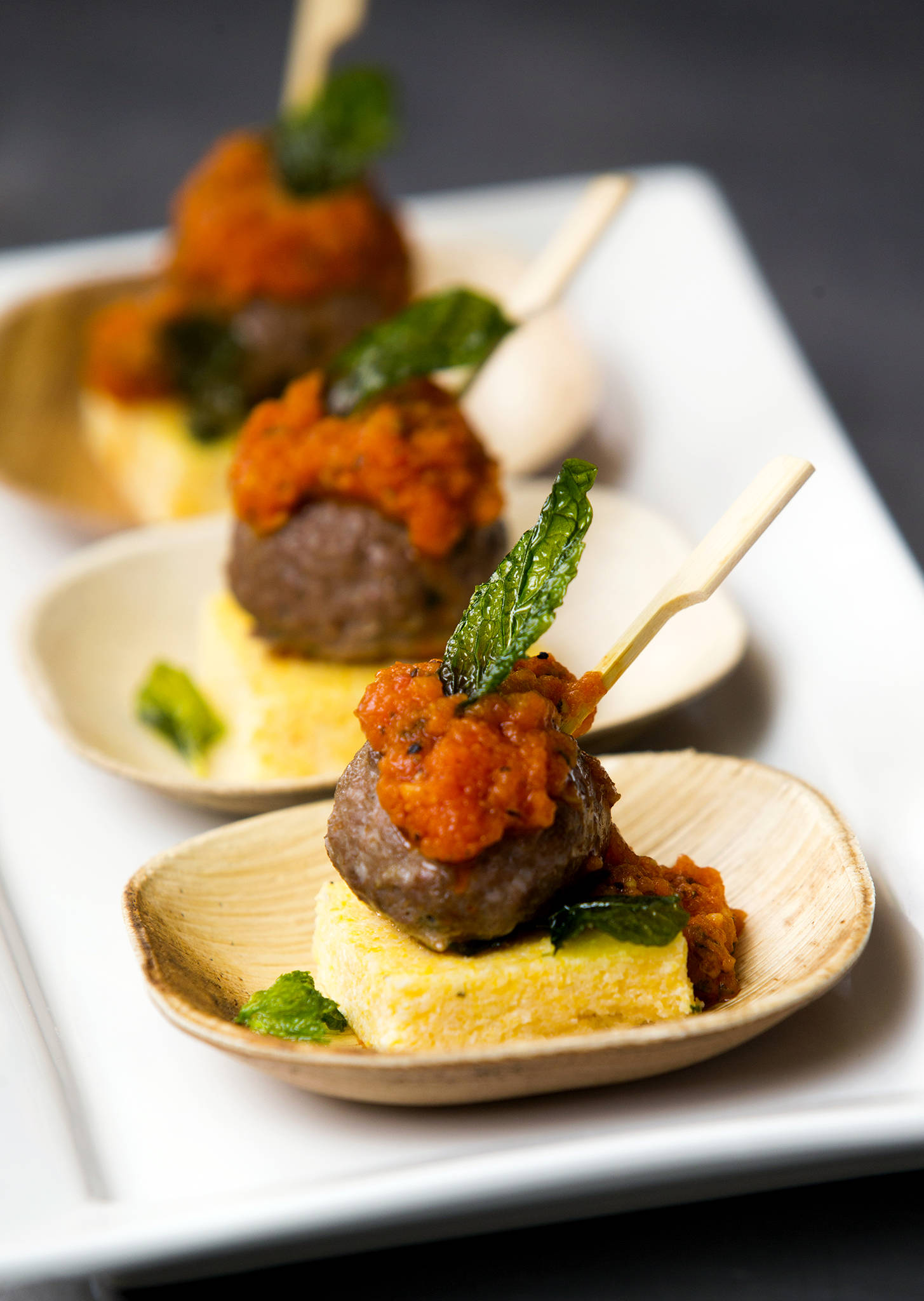 Chef Dane Catering will serve a lamb meatball on a polenta crouton with smoked tomato sauce and fried mint at The Art of Food and Wine on Feb. 8 at the Lynnwood Convention Center. (Andy Bronson / The Herald)
