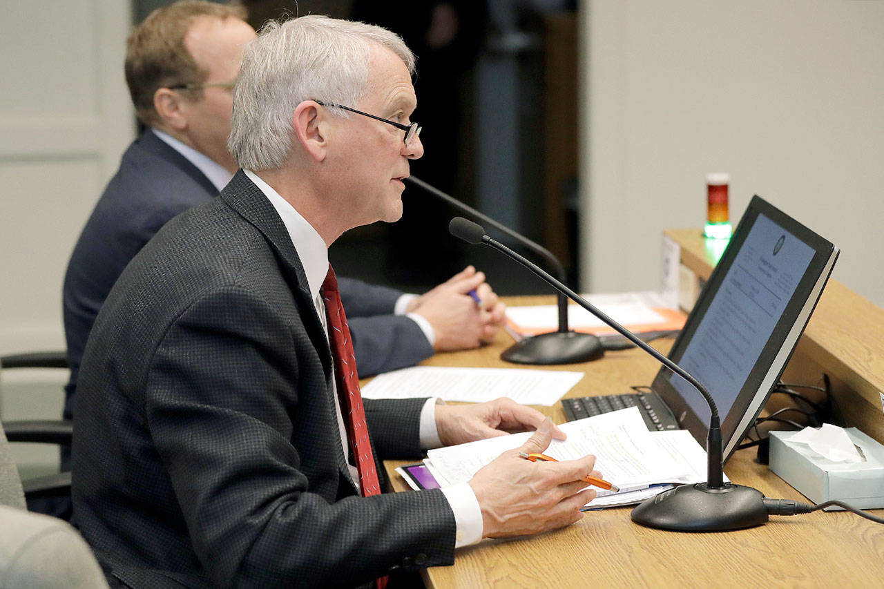 Paul Roberts, a member of the Everett City Council and vice chairman of the Sound Transit Board of Directors, speaks Tuesday during a hearing before the state Senate Transportation Committee at the Capitol in Olympia. (AP Photo/Ted S. Warren)