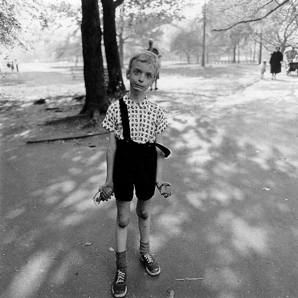 “Child with Toy Hand Grenade in Central Park” was taken by famed photographer Diane Arbus (1923-1971) in 1962.
