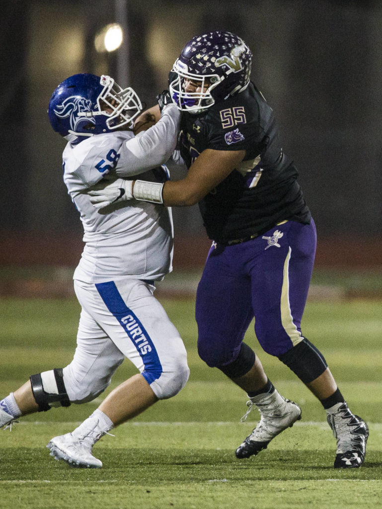 Lake Stevens’ Logan Bruce (right) blocks Curtis’ Isaac Pineda during a game on Nov. 9, 2018, in Lake Stevens. (Olivia Vanni / The Herald)
