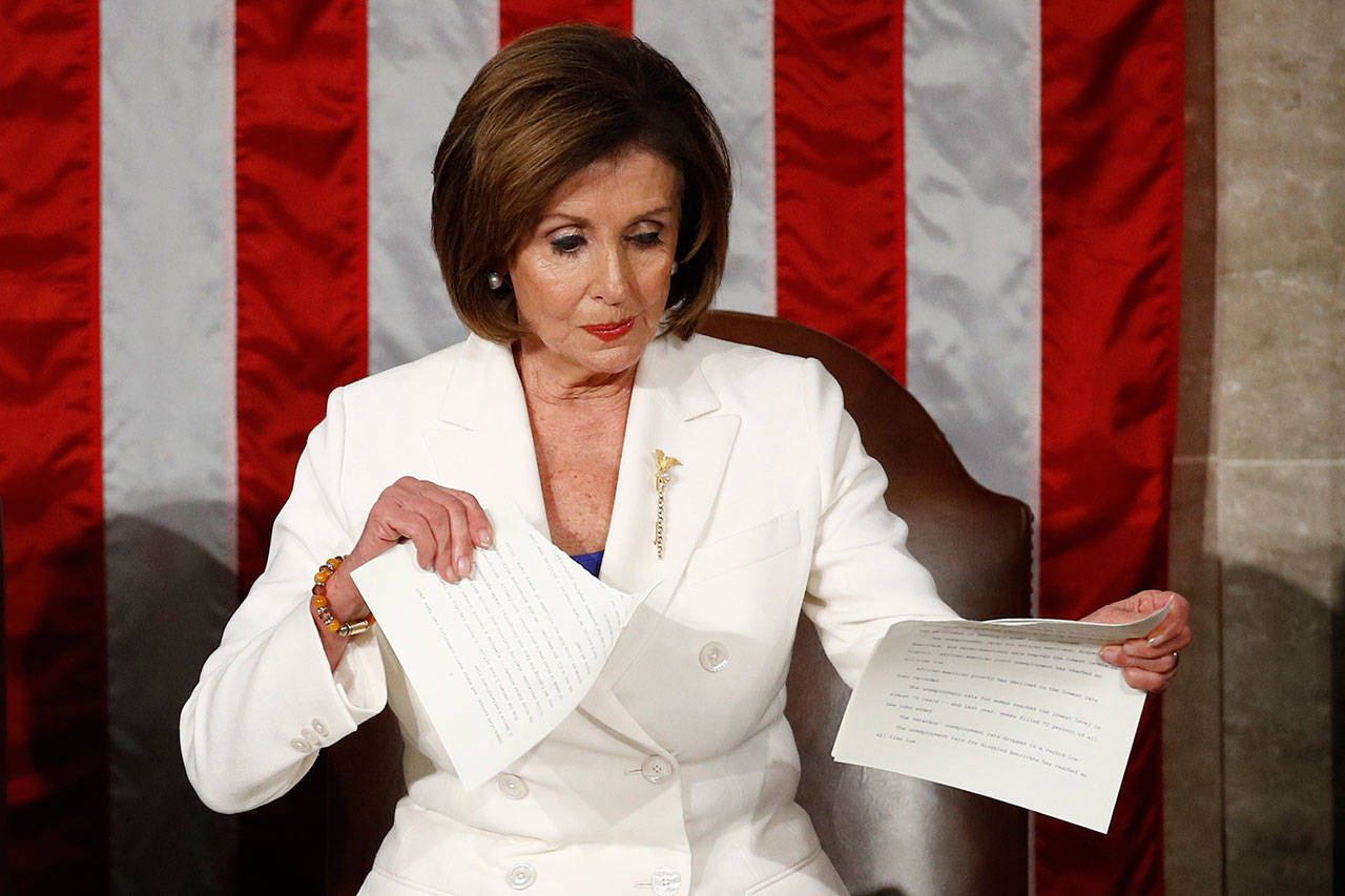 House Speaker Nancy Pelosi tears her copy of President Trump’s s State of the Union address after he delivered it to a joint session of Congress on Tuesday on Capitol Hill in Washington. (Patrick Semansky / Associated Press)