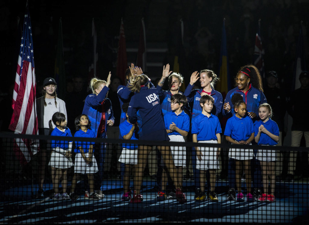 Team USA high fives during the opening ceremony of the Fed Cup at Angel of the Winds Arena on Friday in Everett. (Olivia Vanni / The Herald)
