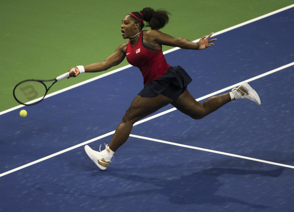 Serena Williams lunges for a ball during her match against Jelena Ostapenko at the Fed Cup at Angel of the Winds Arena on Friday in Everett. (Olivia Vanni / The Herald)

