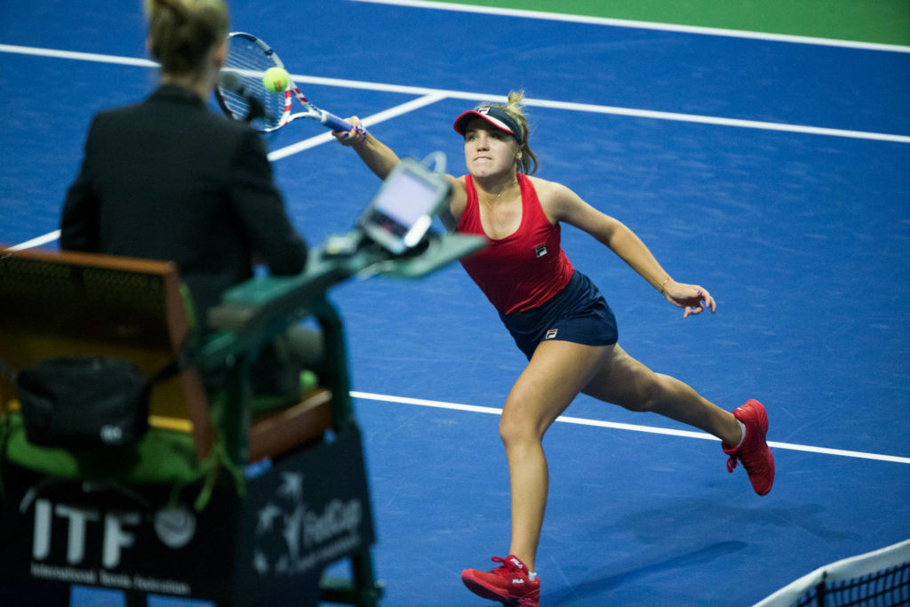 Sofia Kenin chases down the ball for appoint as she defeated Anastasija Sevastova 6-2, 6-2 during her FedCup qualifying round at Angel of the Winds Arena on Friday in Everett. (Andy Bronson / The Herald)
