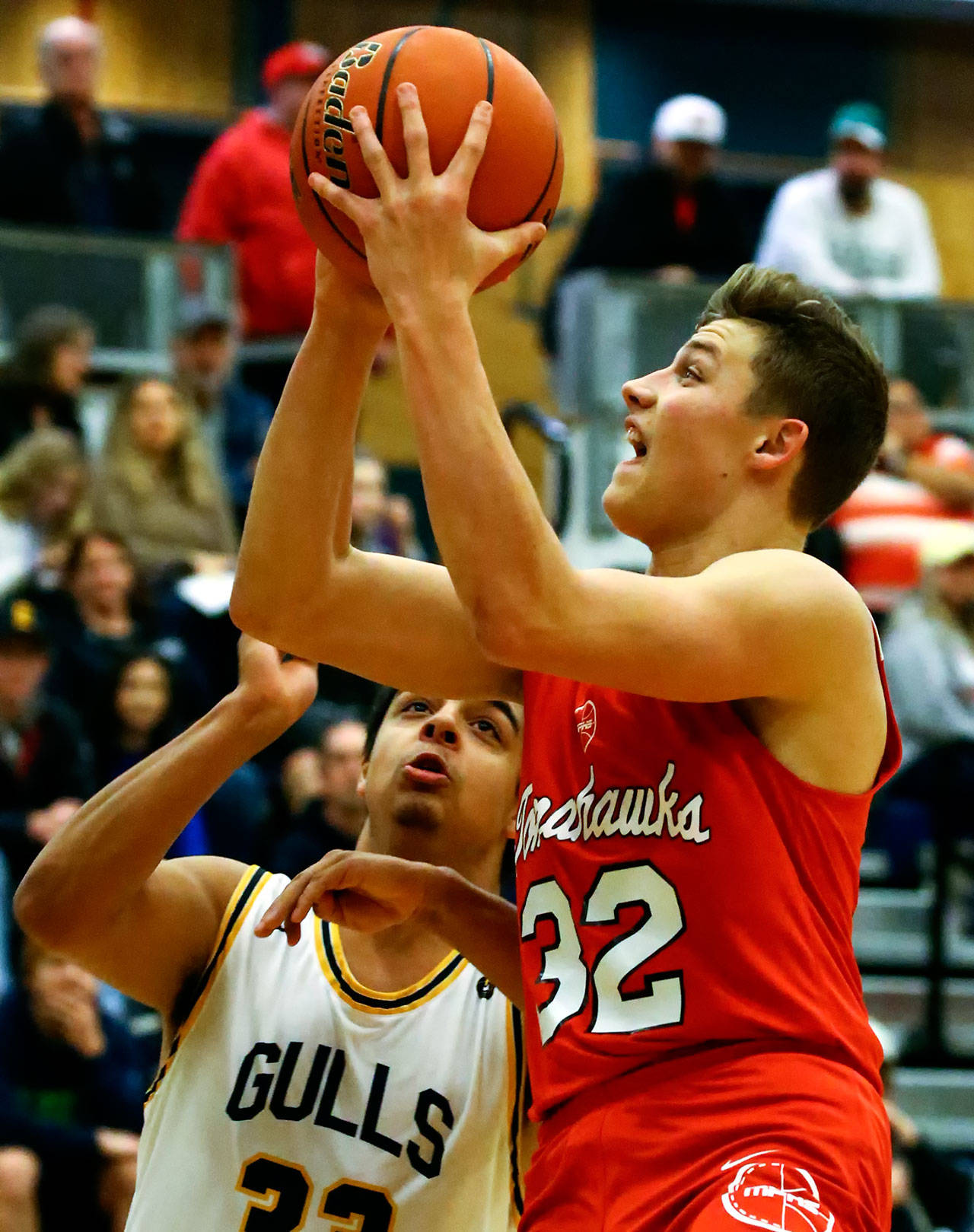 Marysville Pilchuck’s Aaron Kalab attempts a shot with Everett’s Daryl Milam defending Friday evening at Everett High School in Everett on February 7, 2020. (Kevin Clark / The Herald)