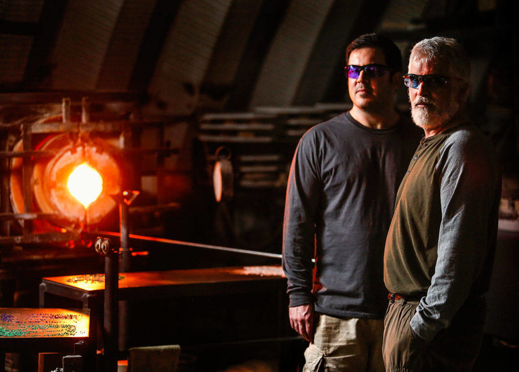 Mark Ellinger and his son Marcus make the glass floats for the Great Northwest Glass Quest. (Dan Bates / The Herald)
Mark Ellinger and his son, Marcus make the glass floats for the Great Northwest Glass Quest. (Dan Bates / The Herald)
