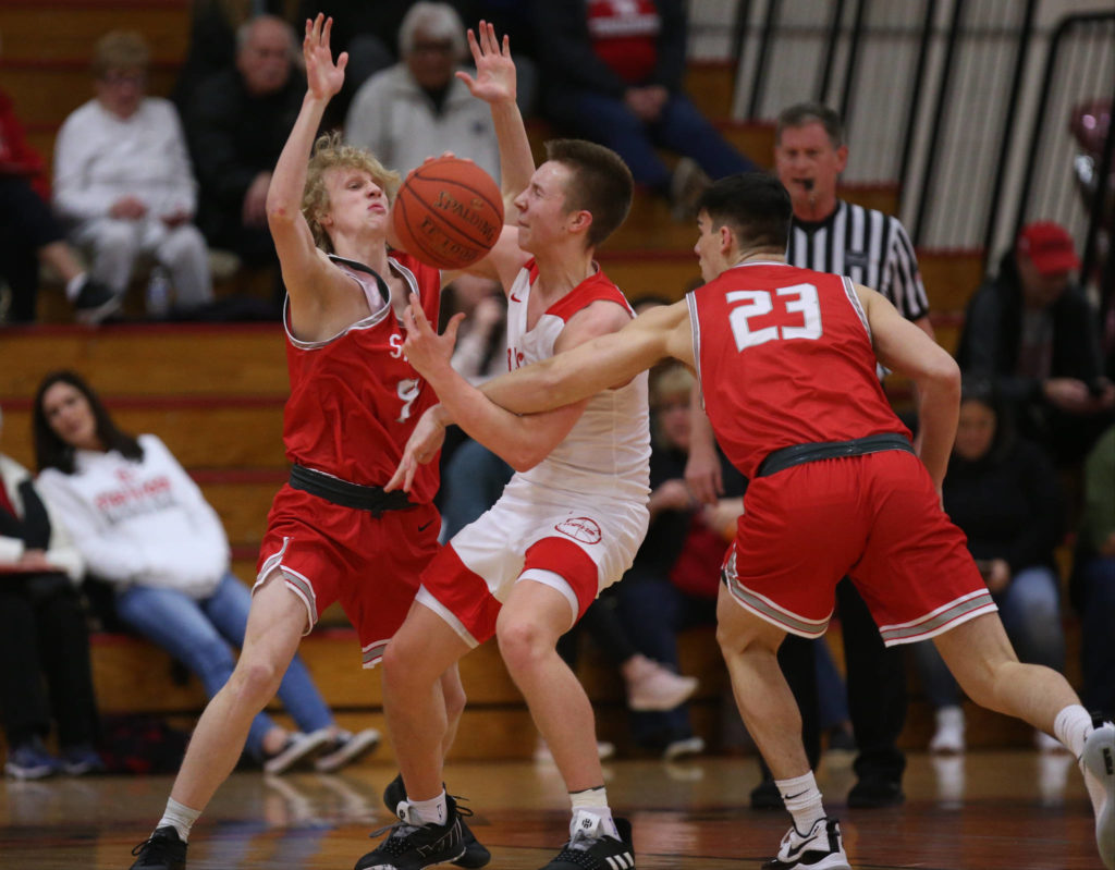 Stanwood’s Zane Strieby fouls Marysville Pilchuck’s Luke Dobler as Marysville Pilchuck beat Stanwood 76-31 in a basketball game Monday, Feb. 10, 2020 in Marysville. (Andy Bronson / The Herald)
