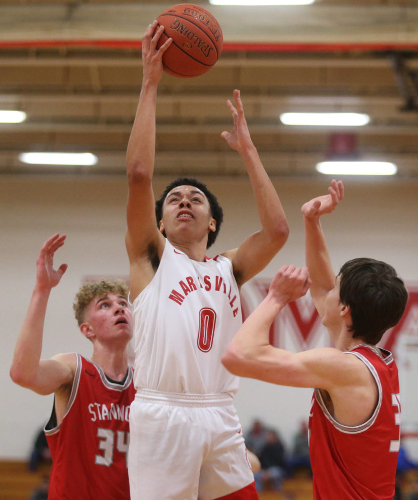 Marysville Pilchuck’s Ethan Jackson attempts a layup as Marysville Pilchuck beat Stanwood 76-31 in a basketball game Monday, Feb. 10, 2020 in Marysville. (Andy Bronson / The Herald)
