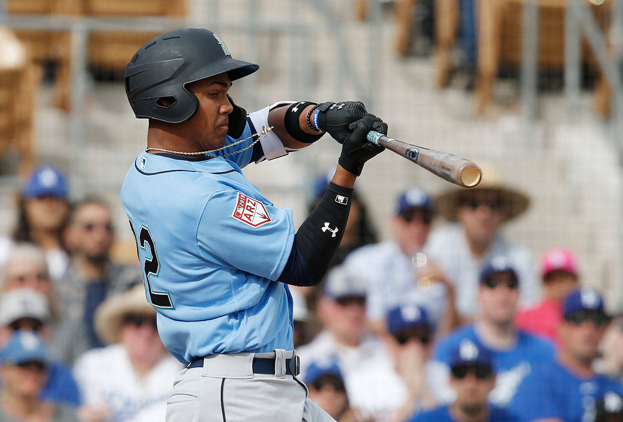 The Mariners’ Julio Rodriguez slashed .326/.390/.540 across Mid-A West Virginia and High-A Modesto as an 18-year-old last season. (AP Photo/Sue Ogrocki)