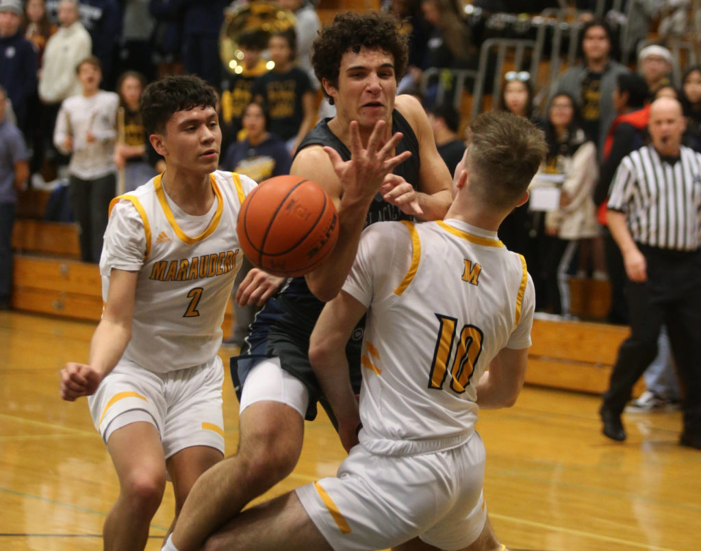 Glacier Peakճ Brayden Quantrille is fouled by Mariner’s Roman Savchuk as he drives to the basket. Mariner lost to Glacier Peak 90-87 in double overtime in a boys’ basketball game on Tuesday, Feb. 11, 2020 in Everett, Wash. (Andy Bronson / The Herald)
