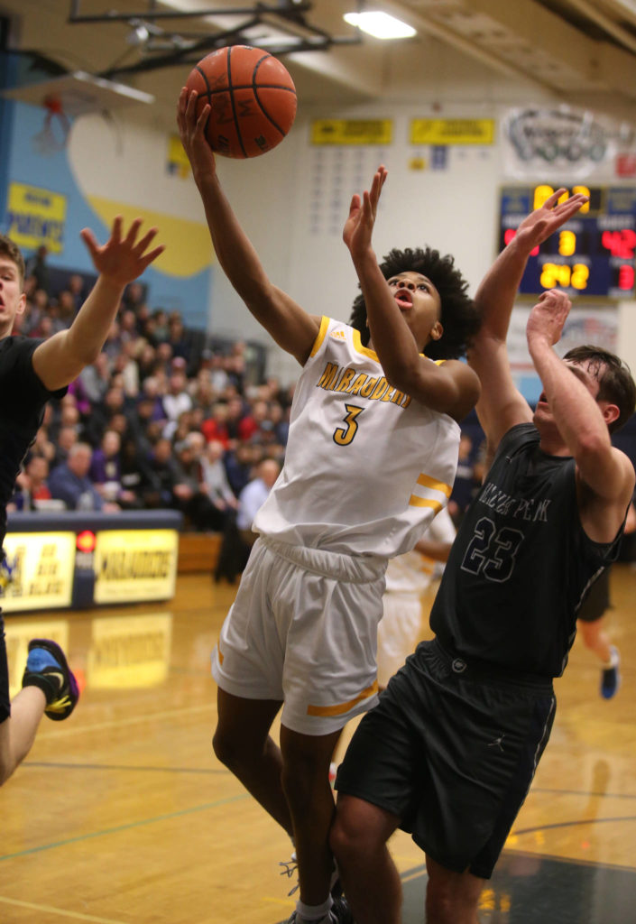 Mariner’s Jailin Johnson scores a basket on a layup as Mariner lost to Glacier Peak 90-87 in double overtime in a boys’ basketball game on Tuesday, Feb. 11, 2020 in Everett, Wash. (Andy Bronson / The Herald)
