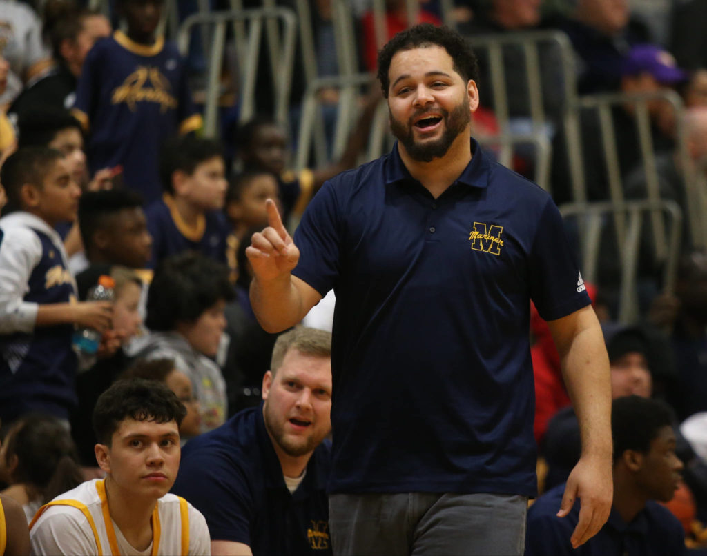 Mariner head coach Tevin Dillon jokes with the referee in the second half as Mariner lost to Glacier Peak 90-87 in double overtime in a boys’ basketball game on Tuesday, Feb. 11, 2020 in Everett, Wash. (Andy Bronson / The Herald)
