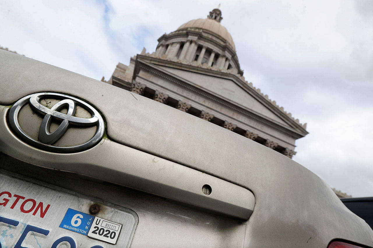 A car registration tab is shown on a vehicle parked at the Capitol on Wednesday in Olympia. (AP Photo/Ted S. Warren)