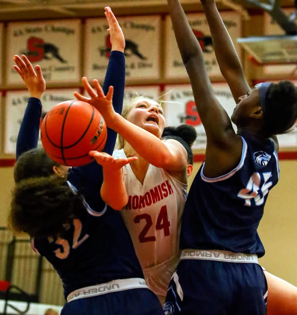 The Snohomish Panthers defeated the Meadowdale Mavericks, 57-39, in a 3A Northwest District Tournament game Friday night at Snohomish High School. (Kevin Clark / The Herald)
