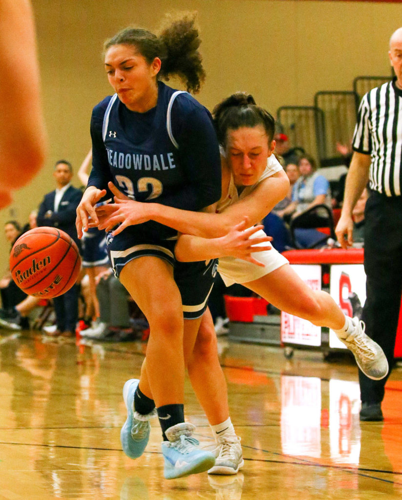 The Snohomish Panthers defeated the Meadowdale Mavericks, 57-39, in a 3A Northwest District Tournament game Friday night at Snohomish High School. (Kevin Clark / The Herald)
