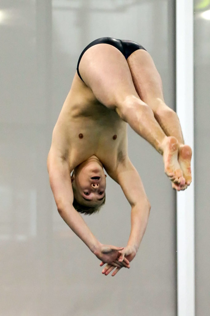 Lake Stevens’ Jaden Cardona competes in the 1-meter diving during the 4A Northwest District swim and dive finals Saturday at Snohomish Aquatic Center in Snohomish. (Kevin Clark / The Herald)
