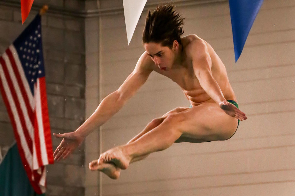 Shorewood’s Issac Poole competes in the 1 meter diving event at Shoreline Pool on Jan. 7, 2020. Poole won the event with a school-record score of 375.8. (Kevin Clark / The Herald)
