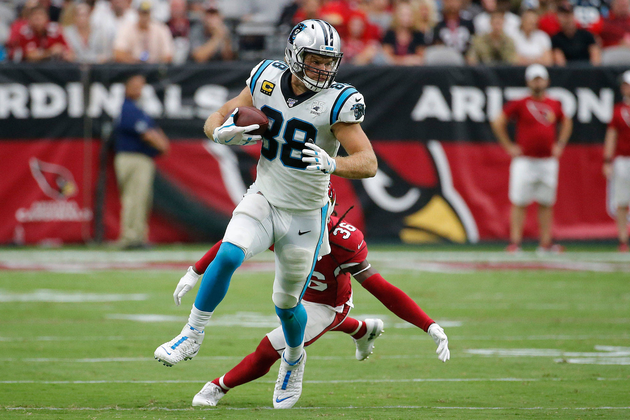 Panthers tight end Greg Olsen (88) runs as Cardinals free safety D.J. Swearinger (36) pursues during a game Sept. 22, 2019, in Glendale, Ariz. Olsen agreed to terms on a one-year deal with the Seahawks on Tuesday. (AP Photo/Rick Scuteri)