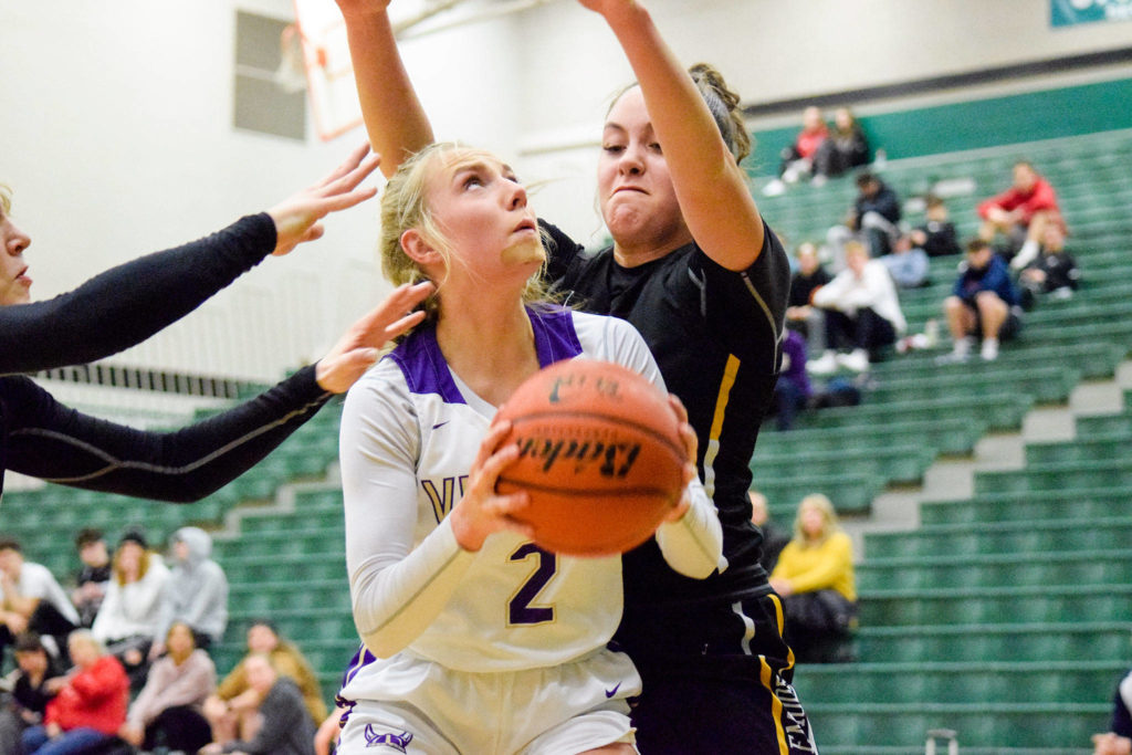 Lake Stevens’ Chloe Pattison looks up to shoot a basket against Inglemoor in a Wes-King Bi-District Tournament winner-to-state, loser-out game on Thursday at Jackson High School in Mill Creek. (Katie Webber / The Herald)

