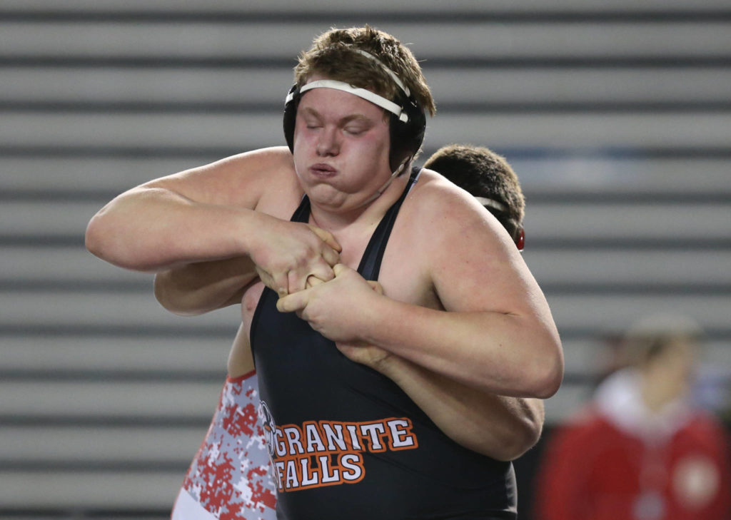 Granite Fall’s Ben Vanderwel struggles to escape from Cascade Leavenworth’s Hunter Reinhart during their 1A 285-pound championship match at Mat Classic XXXII on Saturday at the Tacoma Dome. (Andy Bronson / The Herald)
