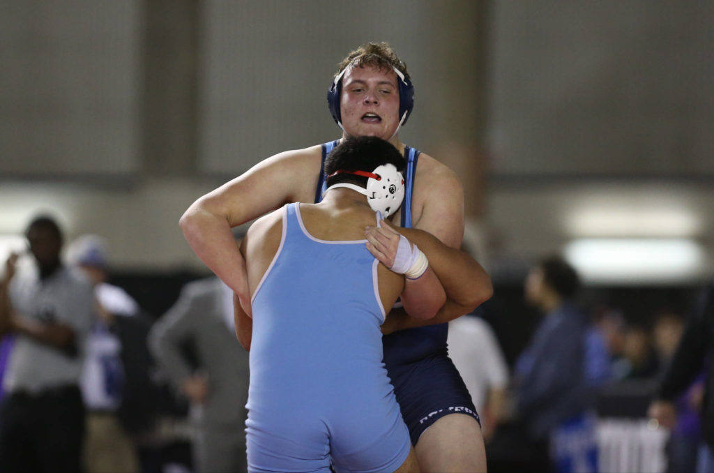 Meadowdale’s Alex Krueger (rear) attempts to take down Chief Sealth’s Jahvias Leui during their 3A 285-pound championship match at Mat Classic XXXII on Saturday at the Tacoma Dome. (Andy Bronson / The Herald)
