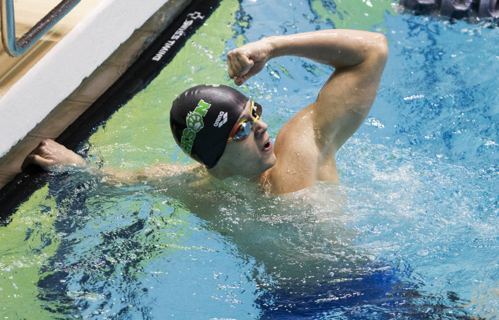 Jackson’s Justin Limberg pumps a fist after winning the 4A state title in the 200-yard individual medley Saturday at the Federal Way Aquatic Center. (Andy Bronson / The Herald)
